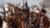 Reprezentanți ai mișcării Houthi în timpul unei adunări la sfârșitul unui antrenament militar, la periferia orașului Sana'a, Yemen, 22 ianuarie 2024