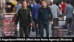 Iranian Women Continue To Defy Head-Scarf Law As 'Morality' Patrols Return