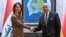 Iraqi Foreign Minister Fuad Hussein (right) receives his German counterpart, Annalena Baerbock, at the Foreign Ministry in Baghdad on March 7.