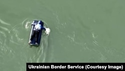 Some Ukrainians seeking to avoid military service attempt to swim across the river that forms part of the border with Romania