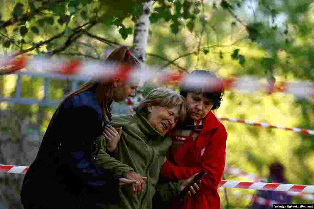 A woman reacts as she looks at the body of her daughter, who was killed during a Russian missile strike in Kyiv on June 1, when many former communist countries celebrate International Children's Day.