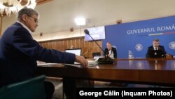 Ministrul de Finanțe, Marcel Boloș (prim-plan), conduce unul dintre ministerele care vor fi implicate în tehnologizarea instituțiilor responsabile de colectarea banilor la buget.