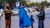 Taliban security stand guard on the street in Kabul on August 11.