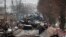 Искореженные останки российской военной техники на дороге в городе Буча, недалеко от Киева, вторник, 1 марта 2022 года