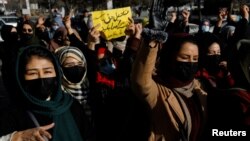 Afghan women demonstrate against the closure of universities to women by the Taliban in Kabul on December 22.
