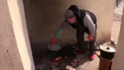 Bombs, Basements, And Burials: Besieged Mariupol Residents Struggle To Survive Bombs, Basements, And Burials: Besieged Mariupol Residents Struggle To Survive