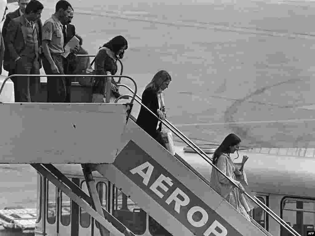 Former hostages, released by their captors, arrive at France's Orly airport on November 20, 1979.