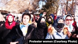Afghan women and girls protest in Kabul on December 22 against a Taliban ban on female students in universities.