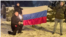 Акция сожжения флага РФ. Слева представители финской организации Uudenmaan Akseli, справа Артур Анккалайнен.