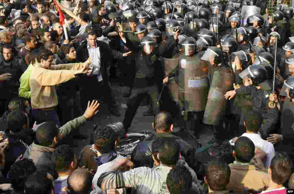 Demonstrators clash with police in central Cairo on January 25, 2011. The protesters were inspired by the uprising in Tunisia that led to the ouster of Zine El Abidine Ben Ali.