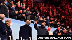 Chinese leader Xi Jinping (center) greets the crowd during the opening ceremony of the Beijing Winter Olympics on February 4.