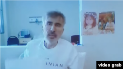 Former Georgian President Mikheil Saakashvili joins his trial via video on February 1. The 55-year-old said there was a widening plot by officials and others to "murder" him.