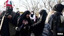 Female spectators gather outside the Mashhad stadium for a World Cup qualifying match between Iran and Lebanon on March 29.