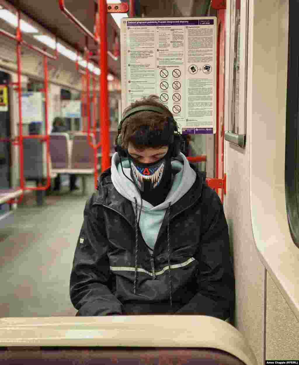 A man dozes in his face mask shortly before 8 a.m. on March 17. 