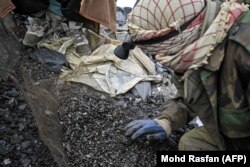 Miners sift for emeralds in the Mikeni Valley.