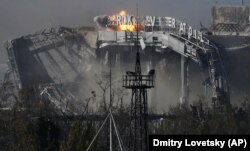 8 жовтня 2014 року – так виглядає міжнародний аеропорт «Донецьк» імені Сергія Прокоф'єва внаслідок обстрілів гібридними проросійськими силами