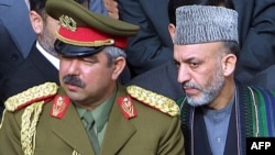 Is Hamid Karzai (right) ready to turn down the demands of powerful warlords like Abdul Rashid Dostum?