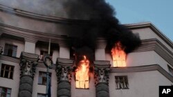 Smoke rises from a fire at Ukraine's Cabinet of Ministers building after a Russian strike on Kyiv on September 7.