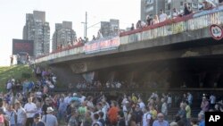 Protesters block traffic on the main highway passing through Belgrade on June 30.
