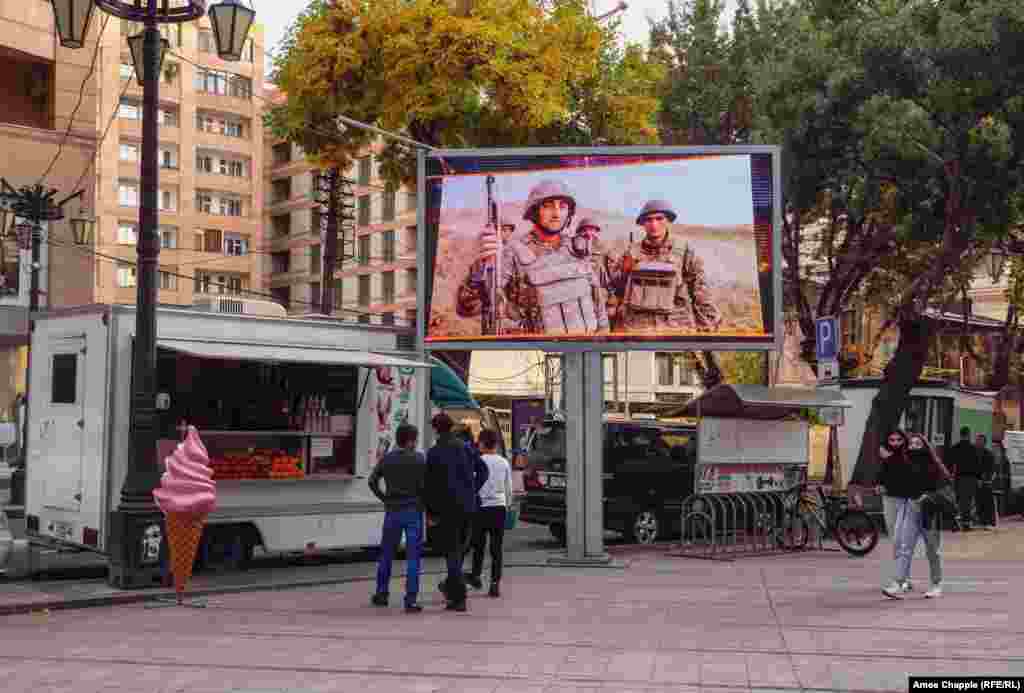 A television plays a loop of soldiers and military exercises in downtown Yerevan on October 28. 