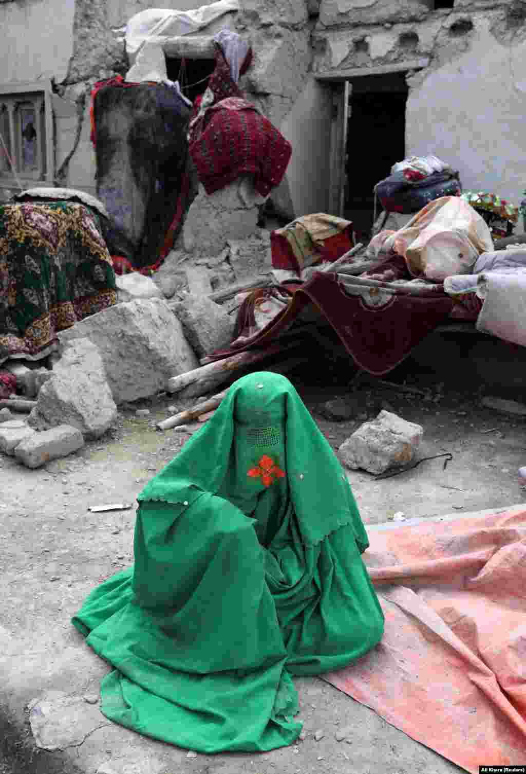 An injured Afghan woman waits for treatment. Taliban officials have stated that the country lacks medical supplies to treat the injured and they have requested humanitarian assistance from the international community. The 6.1 magnitude earthquake struck about 160 kilometers  southeast of Kabul, near the Pakistani border, in an arid mountain region dotted with small settlements that has been frequently contested during decades of war in Afghanistan. The Paktika and Khost provinces were worst hit.