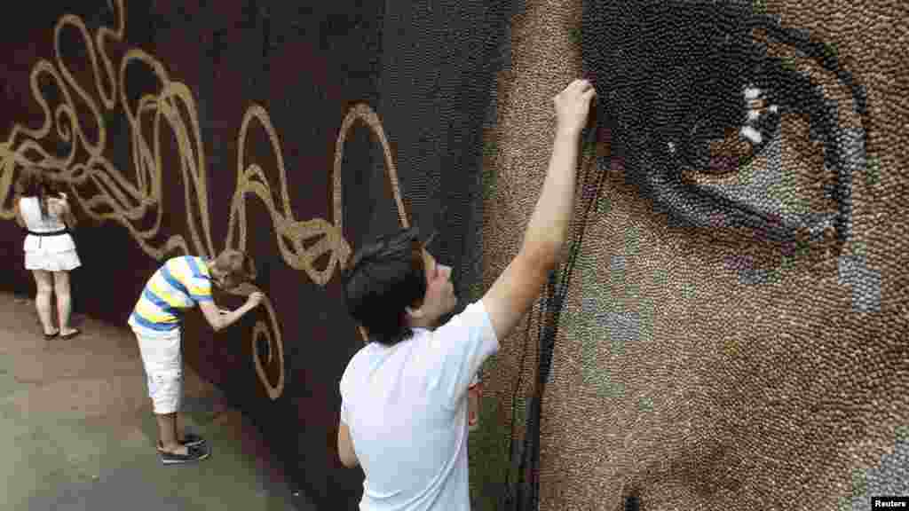 It is also being used as a venue for various creative performances and innovative art installations, such as this mural made completely out of coffee beans. 