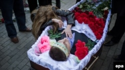 A relative mourns Andriy Biryukov, a pro-Ukrainian supporter who died in the May 2 Odesa clashes.
