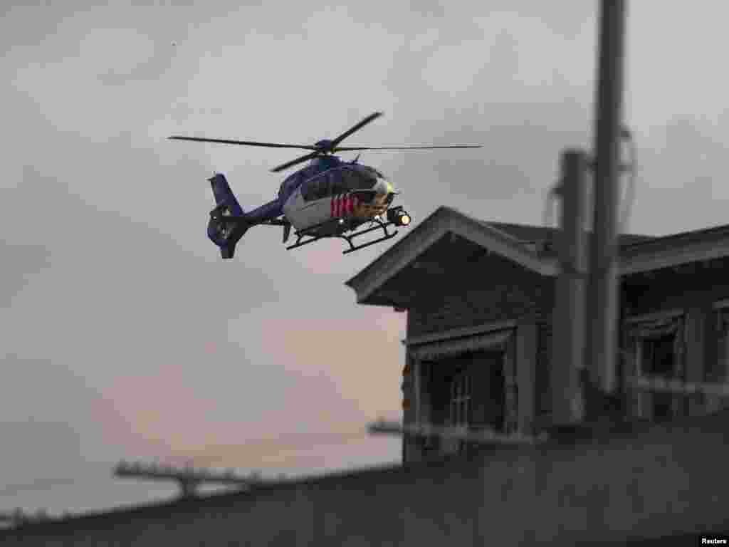 A helicopter believed to be carrying extradited war crimes suspect Ratko Mladic arrives at the Scheveningen prison facility in The Hague on May 31, nearly 16 years after his indictment. REUTERS by Michael Kooren