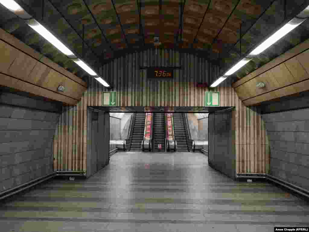An empty subway station entrance on March 17 at 7:36 a.m. -- what would usually be the peak of rush hour. Although transport links remain fully operational, only a fraction of the usual passengers were using public transport. 