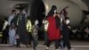 Evacuees from Afghanistan arrive at Hamad International Airport in Qatar's capital, Doha.