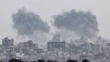 Smoke rises from Gaza after explosions, as seen from Israel