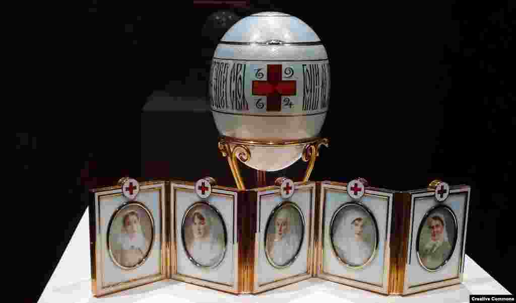The war was a disaster for Russia, which pitted itself against a highly-industrialized Germany. After the royal palaces were converted into hospitals to tend to the wounded, the tsar’s daughters served as nurses. The austere Red Cross Egg of 1915 features the portraits of the tsar’s four daughters and a cousin, dressed in their Red Cross uniforms.  