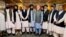 Former Afghan President Hamid Karzai (fifth left) and the ousted government's peace envoy, Abdullah Abdullah (fifth right), meet with members of the Taliban after the militants seized power in Kabul.