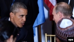 U.S. President Barack Obama (left) talks with his Russian counterpart Vladimir Putin at a luncheon during the UN General Assembly in New York on September 28.