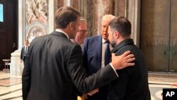 Trump, French President Emmanuel Macron, British Prime Minister Keir Starmer, and Zelenskyy talk briefly at the Vatican.
