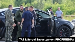 A car and employees of security services are seen at the scene where the body of former Russian Transport Minister Roman Starovoit was found. According to the Russian Investigative Committee, the body of Roman Starovoit with a gunshot wound was found in his car, the main version is suicide.