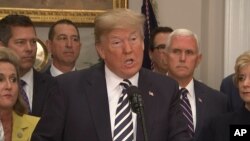 U.S. President Donald Trump speaks about canceling summit with North Korea's Kim Jong Un, with Vice President Mike Pence in the background (right).