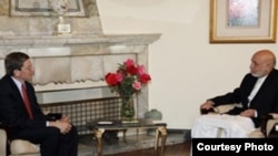 U.S. presidential envoy Marc Grossman (left) with Afghan President Hamid Karzai at a January 2012 meeting in Kabul