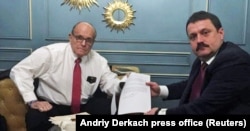Ukrainian lawmaker Andriy Derkach (right) and Rudy Giuliani during a meeting in Kyiv.