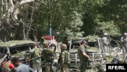 NATO soldiers secure the site of the attack