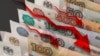 Коршиносон гуфтанд, ки чаро қурби рубл дар Тоҷикистон "бозӣ" дорад