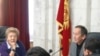 Akylbek Sariev (right), head of Kyrgyzstan's Central Election Commission, announces the results of the country's October 10 parliamentary elections.