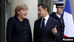 French President Nicolas Sarkozy and German Chancellor Angela Merkel say European leaders are determined to secure euro zone.