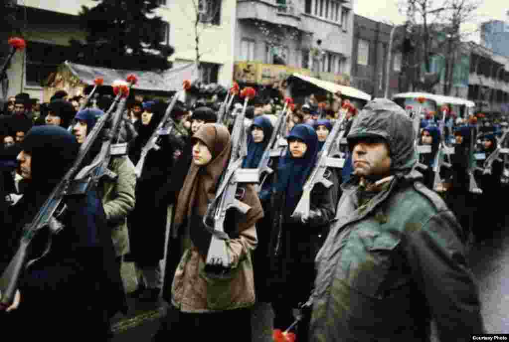 Revolutionaries demonstrate in front of the U.S. Embassy in Tehran. On April 24, 1980, a rescue mission to release the hostages failed after two aircraft collided in the Iranian desert. Eight U.S. soldiers were killed.
