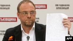 Serhiy Vlasenko, a lawyer for Yulia Tymoshenko, displays a letter she wrote to the President Viktor Yanukovych during a press conference in Kyiv in October.