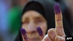 Ink-stained fingers after voting in Al-Najaf