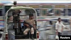 Troops keep guard at an intersection in Karachi