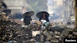 این تصویر از ۲۳ مارس نیروهای پلیس عراق را در منطقهای از موصل نشان میدهد