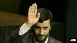 Mahmud Ahmadinejad waves after delivering his speech to the UN General Assembly in 2005.