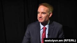 "This is duplicating what were already weak sanctions to begin with," says Michael Carpenter, former U.S. deputy assistant secretary of defense.
